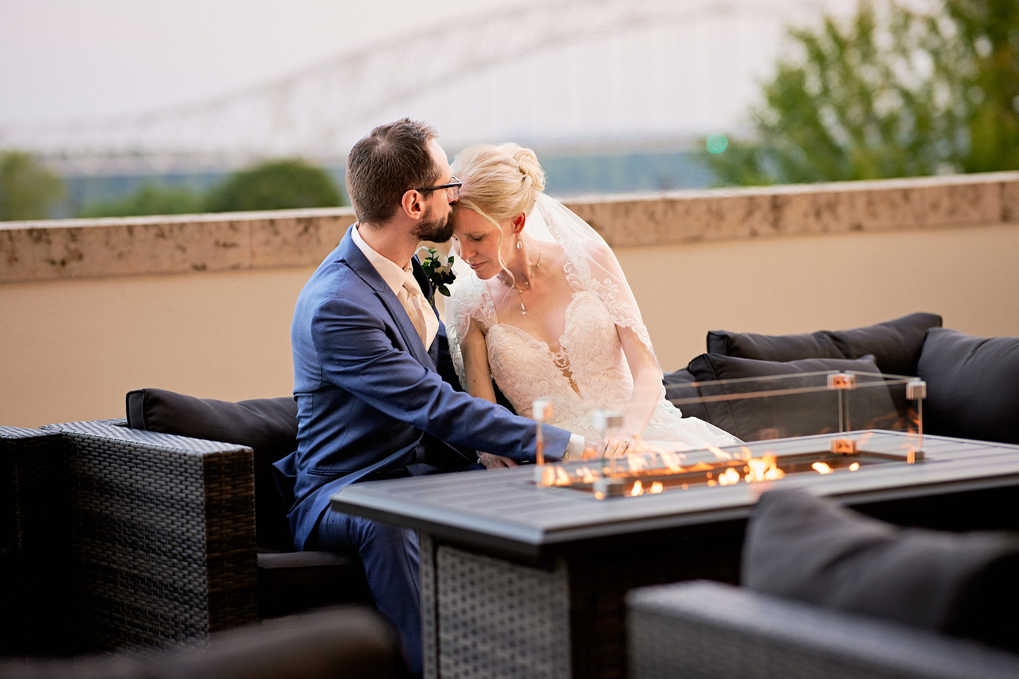 Bride and groom sharing a quiet moment together on the outdoor patio at the Diamond Jo Casino